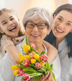 Grandmother, mother and daughter with tulips